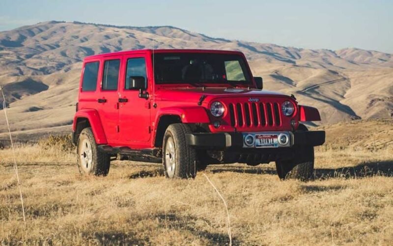 Exploring the Off-Roading Capabilities of a Red Jeep Wrangler